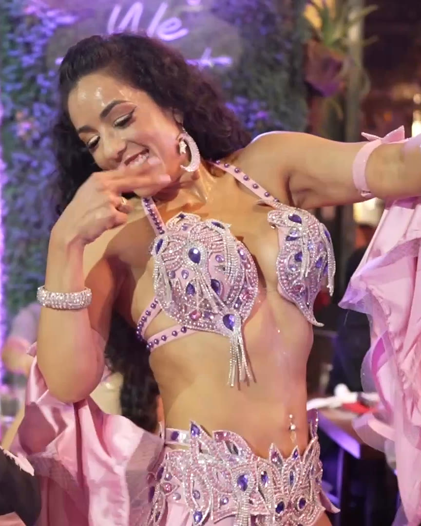 Belly dancer performing among guests at Layali Miami